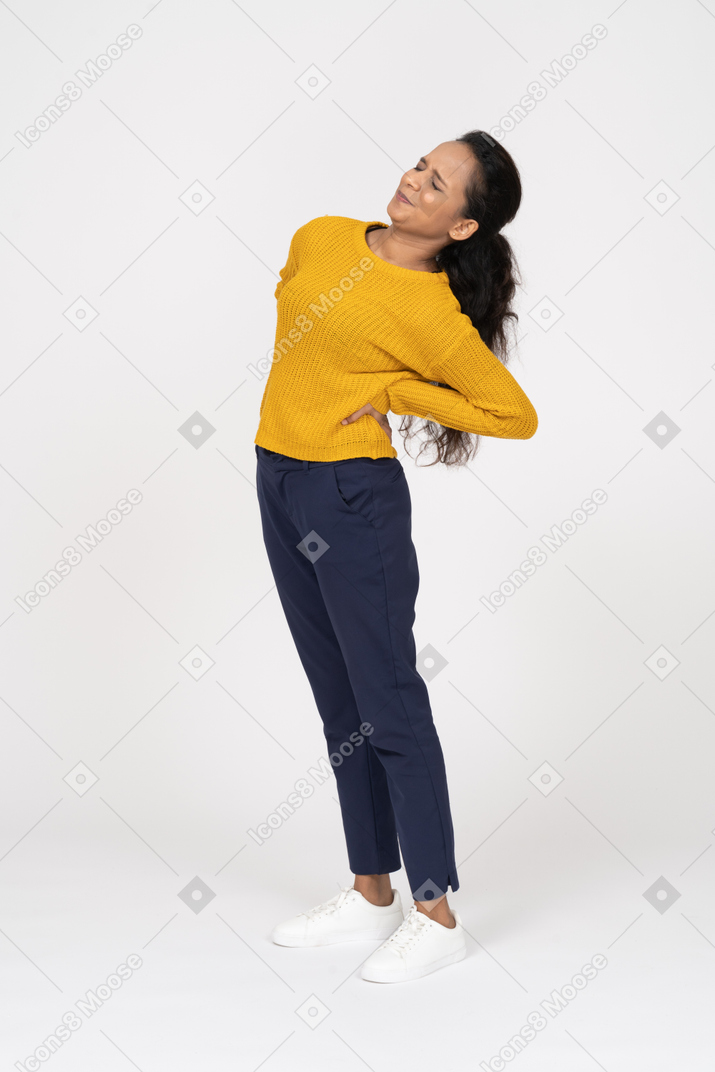 Front view of a girl in casual clothes stretching