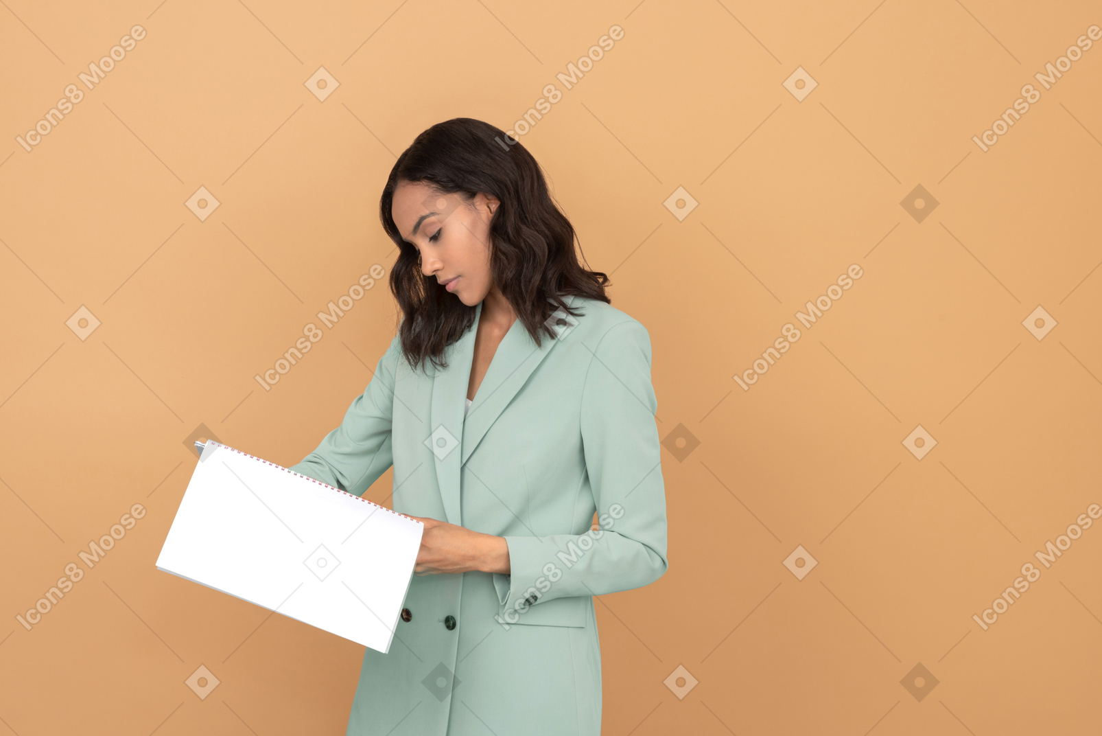 Attractive young woman reading a file