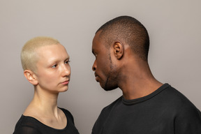 Mad young man looking at woman