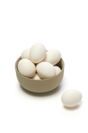 Chicken eggs in a ceramic bowl