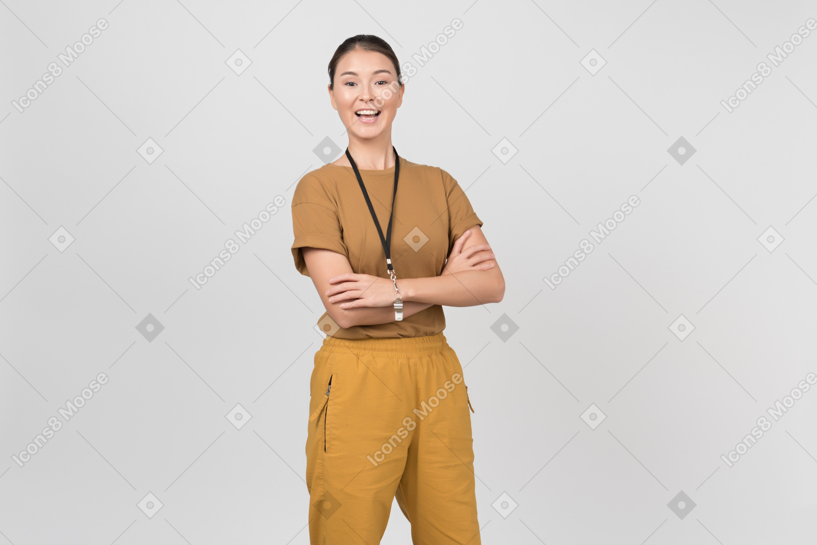 Young smiling pe teacher holding her hands crossed