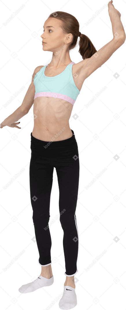 Front view of a teen girl in sportswear widely outspreading her hands