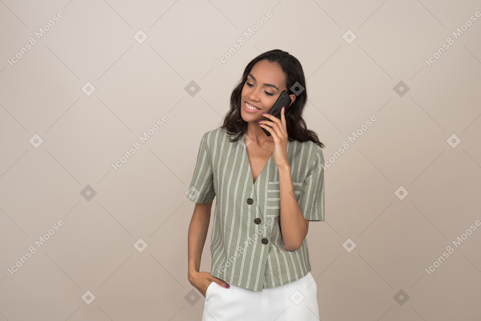 Pretty young girl talking on the phone and dreaming about something