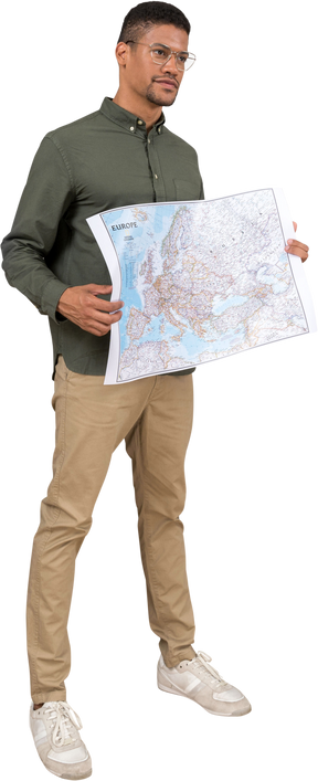 Three-quarter view of a man holding a map