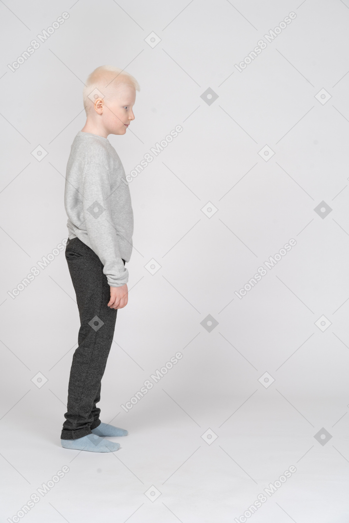 Side view of a boy standing