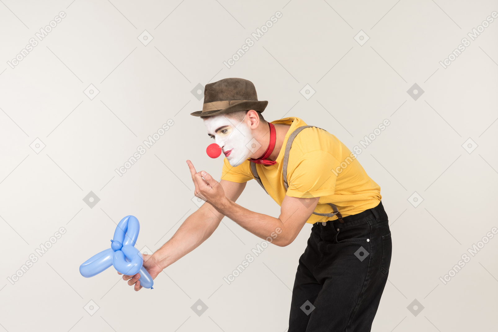 Male clown showing fuck to balloon figure he's holding