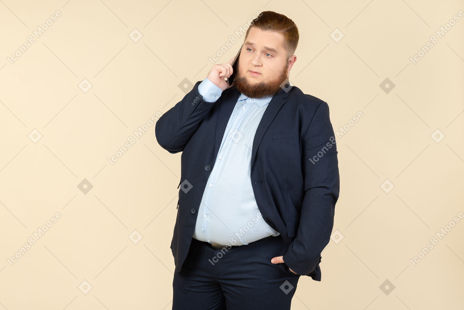 Serious looking young overweight office worker talking on the phone