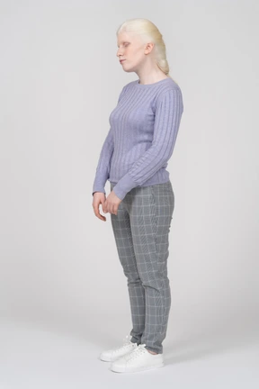 Young woman standing with her eyes closed