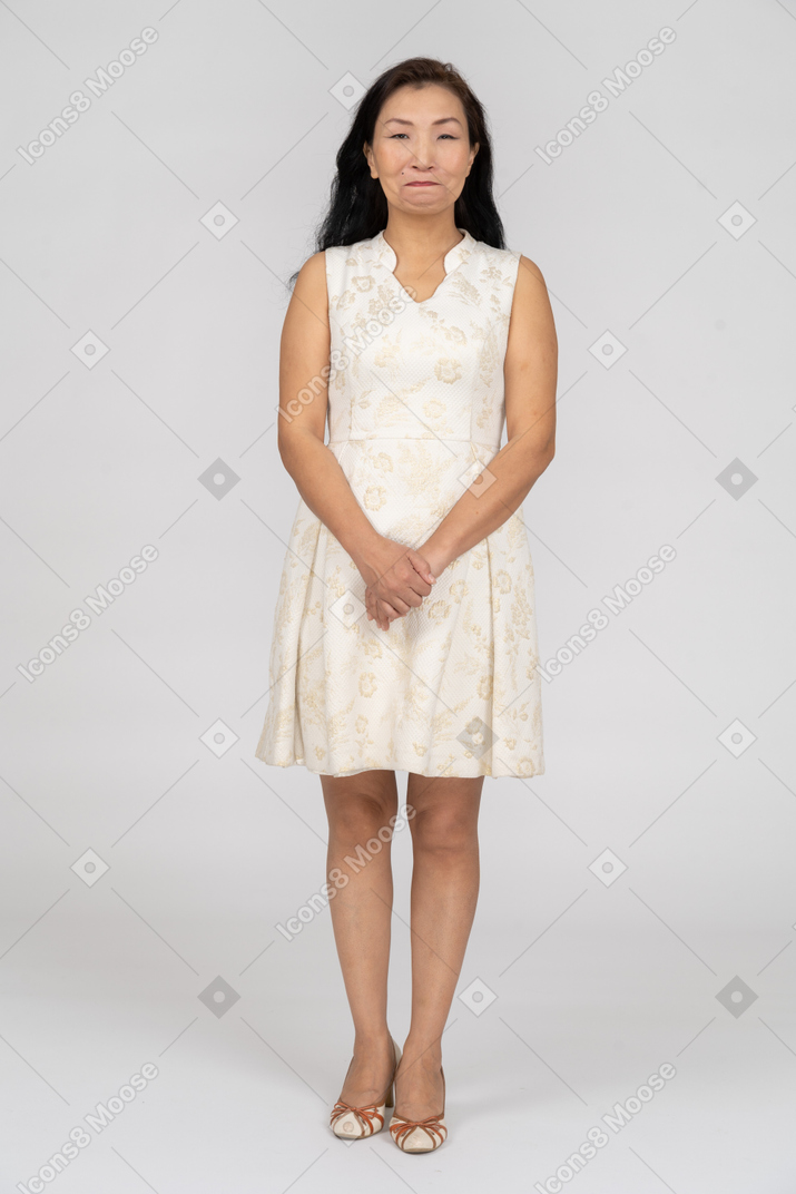 Woman in a white dress standing