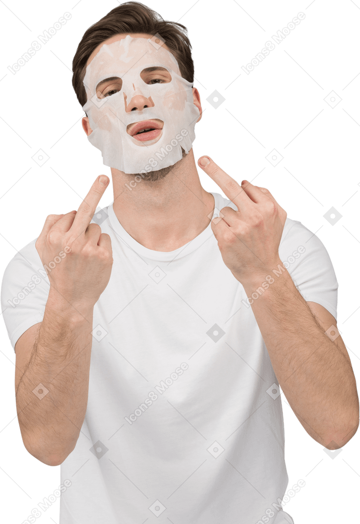 Front view of a young man in facial mask showing middle fingers