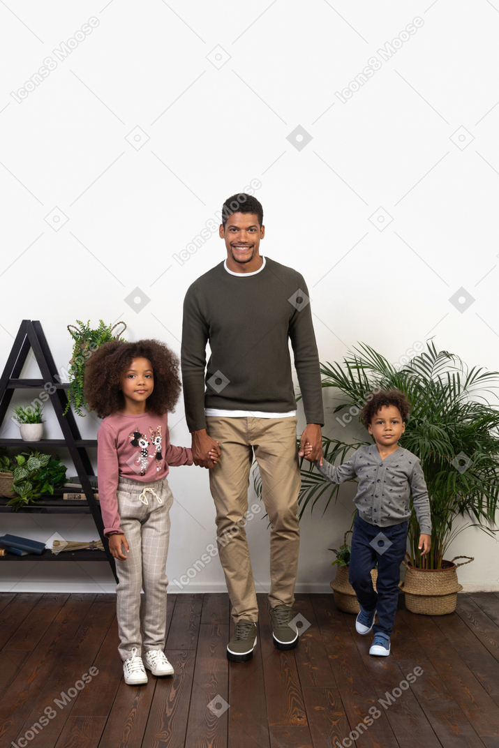Good looking father with his happy children