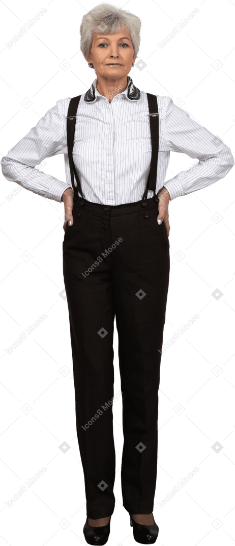 Full-length of an old female in suspenders putting hands on hips