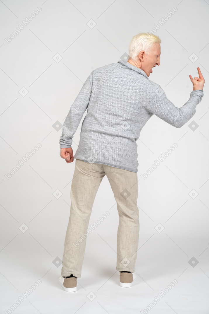 Man showing rock gesture