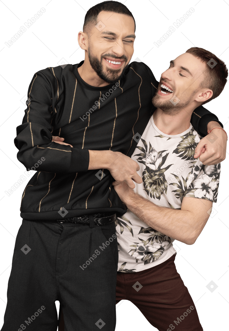 Two young caucasian men side hugging and laughing happily
