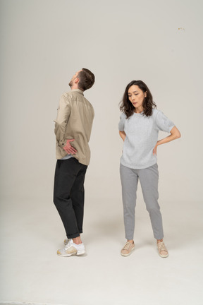 Annoyed young man and woman standing