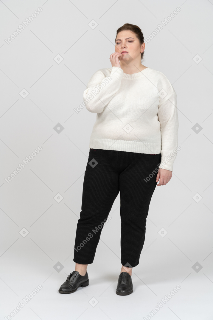 Thoughtful plump woman in casual clothes