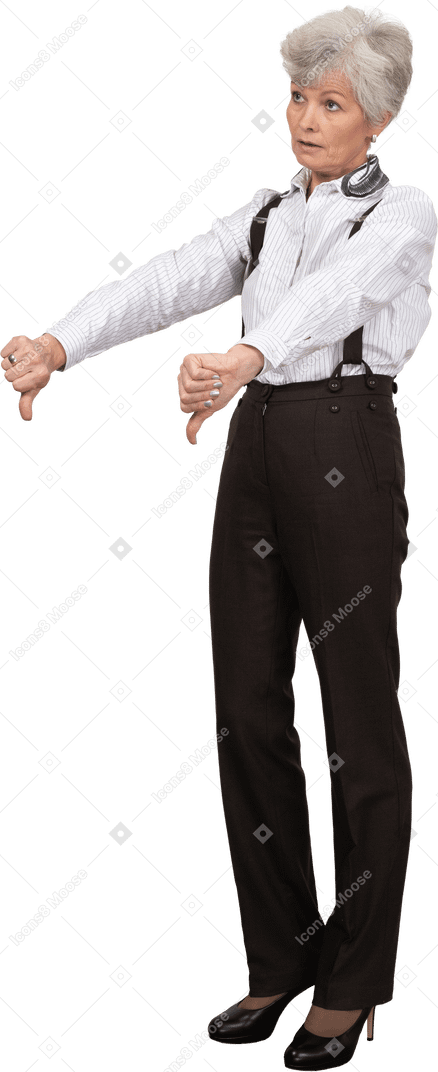 Three-quarter view of an old lady in office clothing putting thumbs down