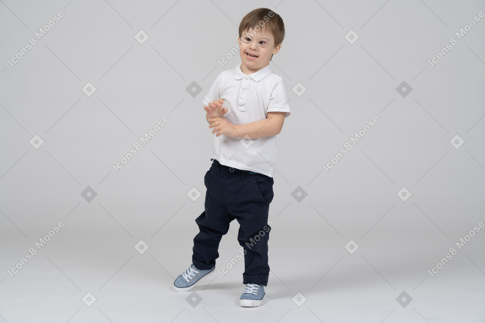 Front view of a cheerful little boy