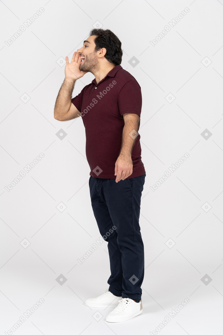 Man in casual clothes calling out loudly