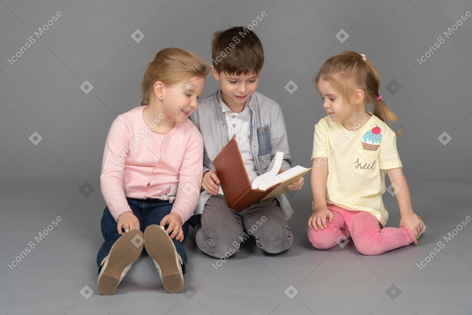 Little boy reading for his friends