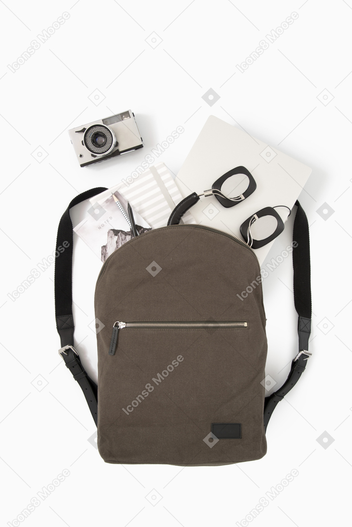 City backpack with laptop, headphones and photo camera