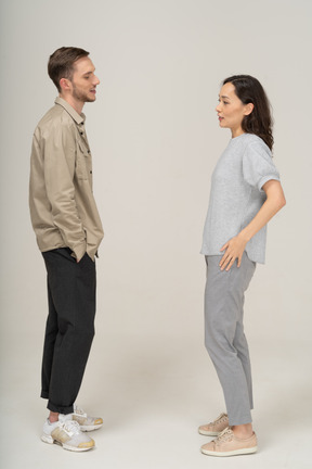 Side view of young couple speaking to each other