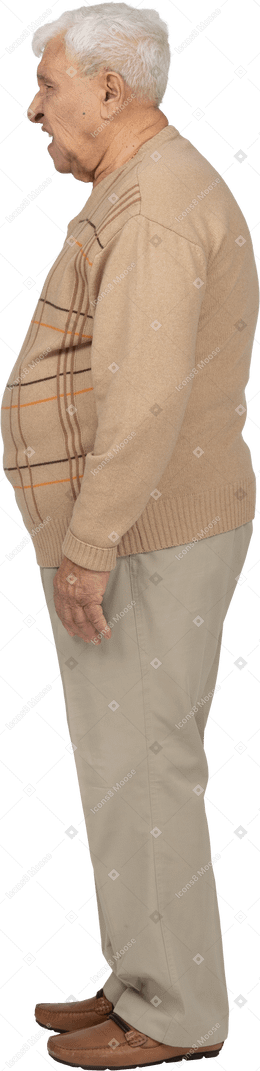 Side view of an angry old man in casual clothes