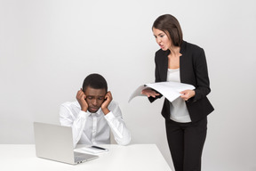 Angry female boss and her upset employee