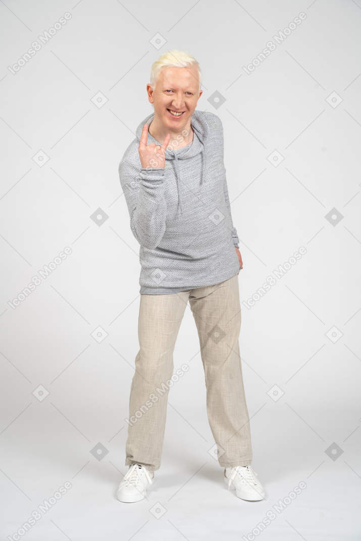 Man showing rock gesture