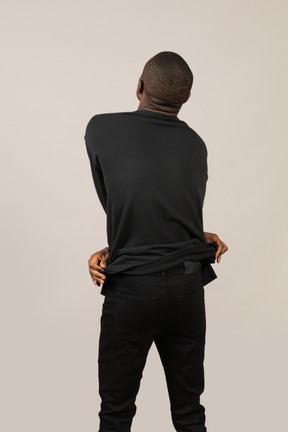 Back view of young man standing