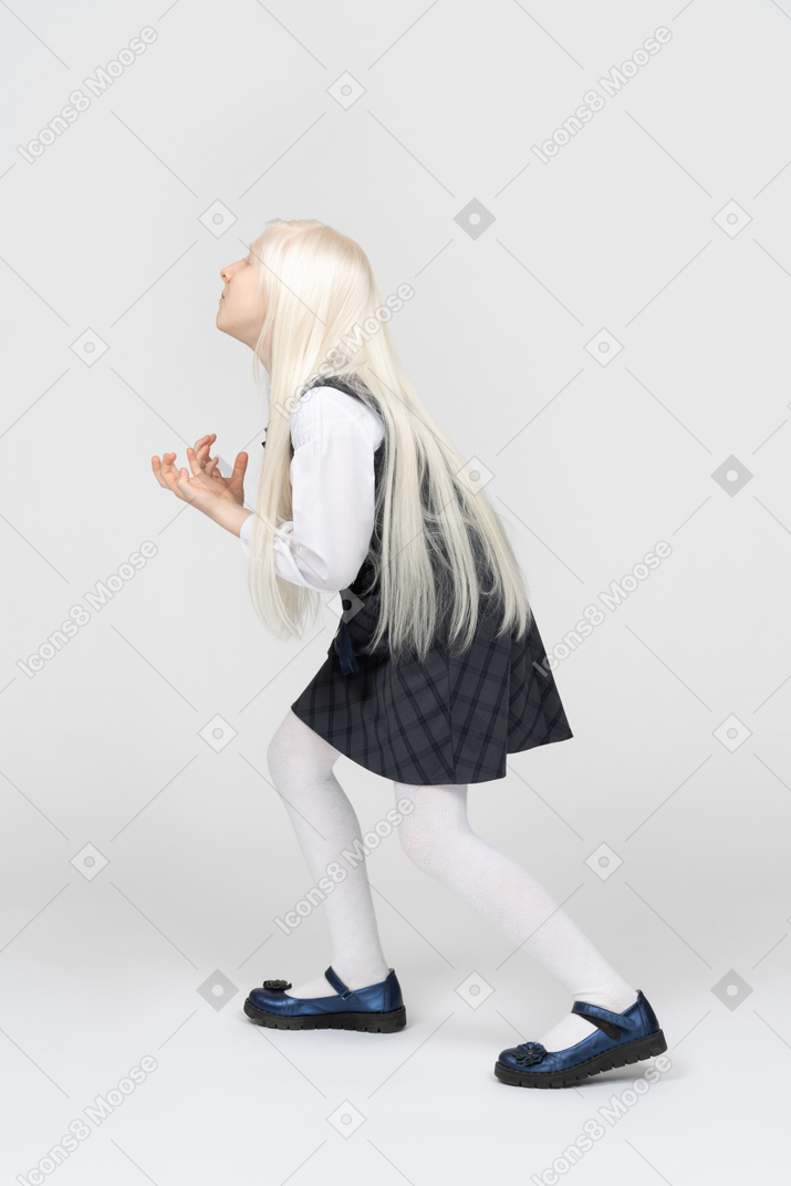 Side view of  a schoolgirl looking annoyed