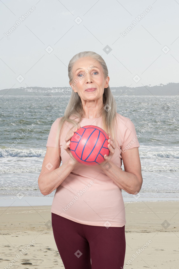 Person with a basketball on the beach