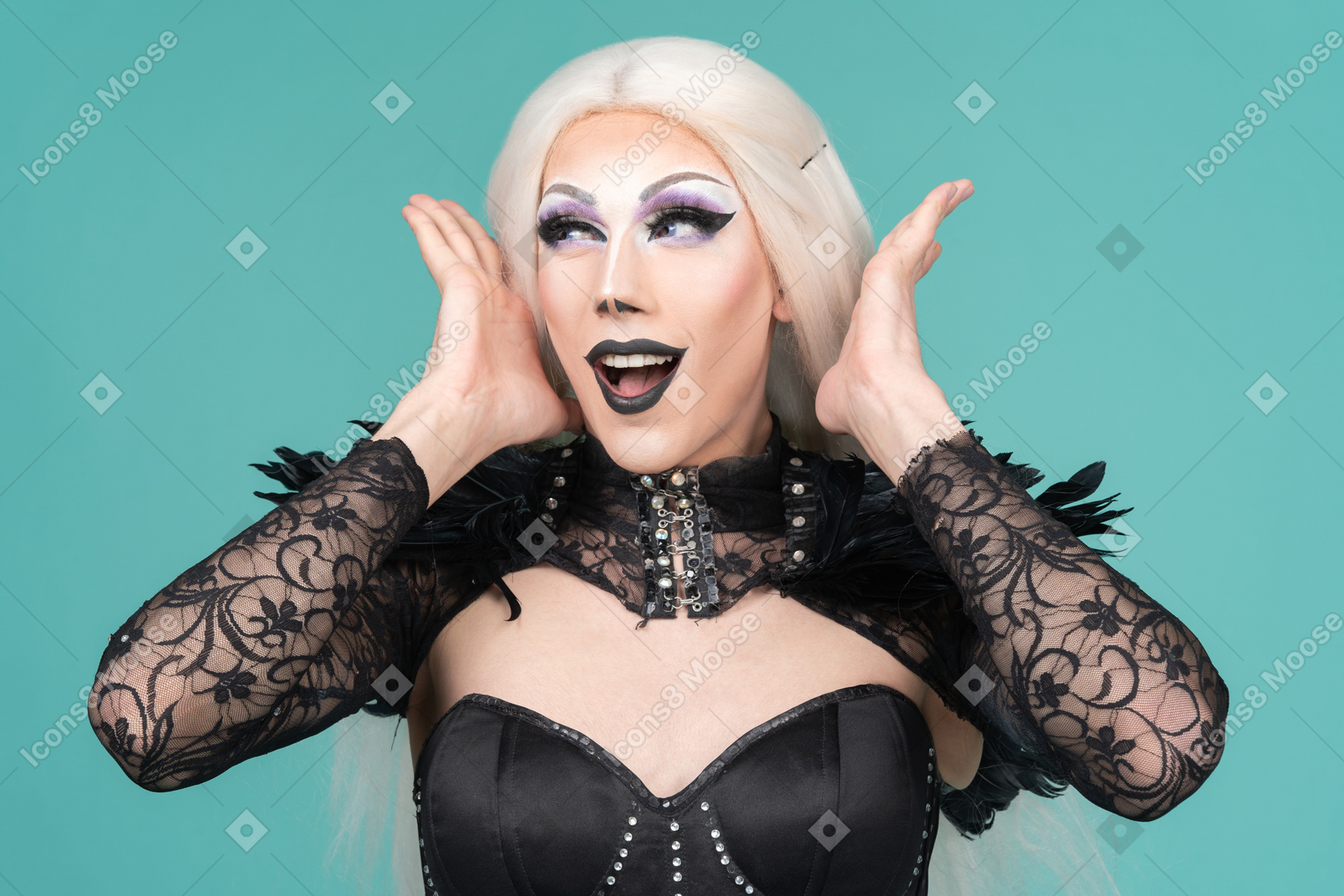Portrait of drag queen placing happy face between hands