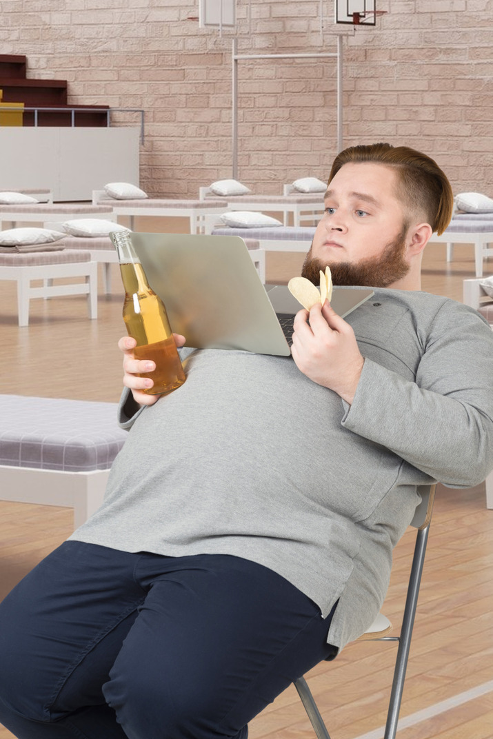 A man sitting at a table with a banana