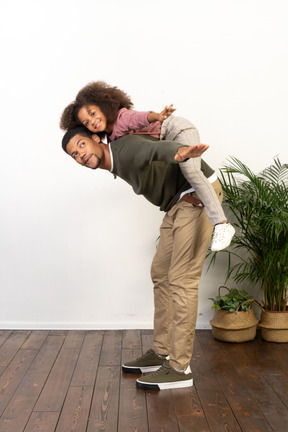 Good looking young man playing with a girl