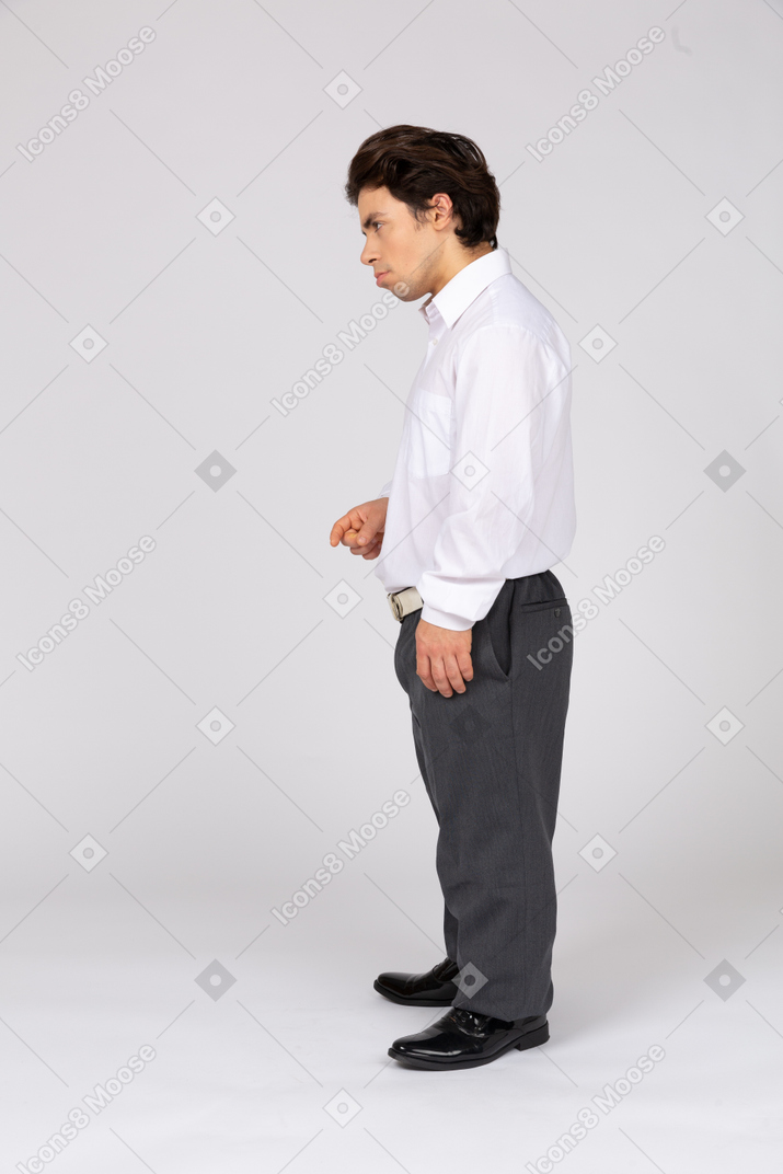 Profile view of a serious man in formalwear looking away