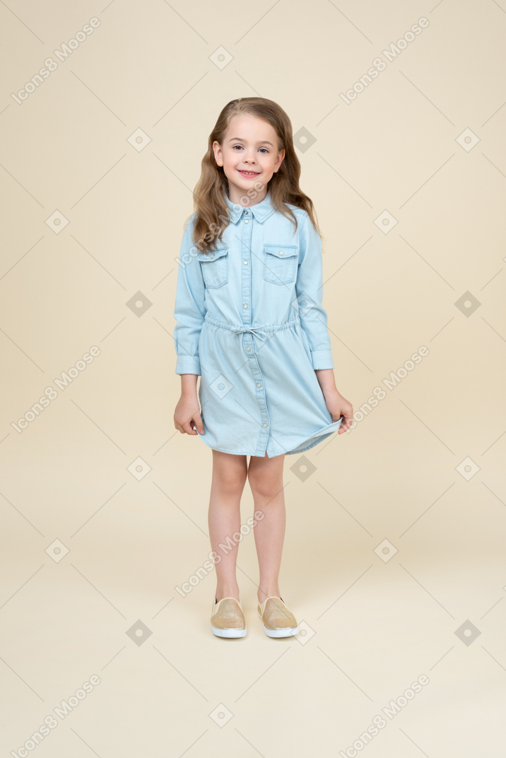 Cute little girl standing and smiling