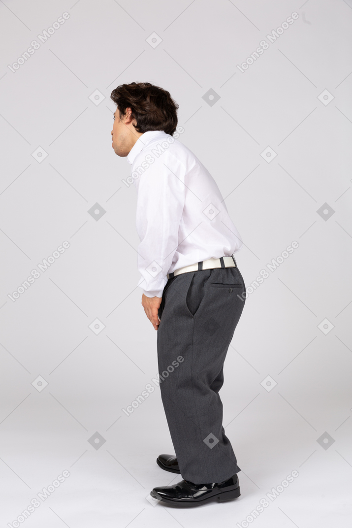 Side view of man bending down