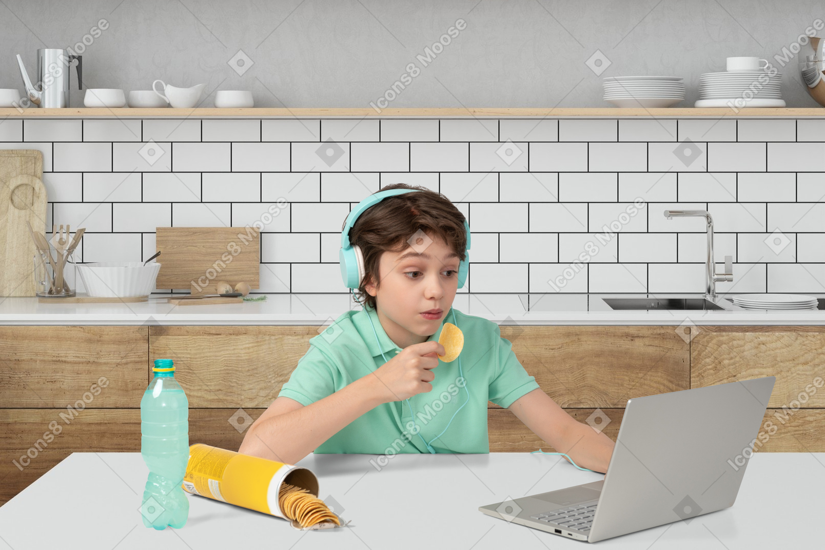 A young boy sitting at a table with a laptop