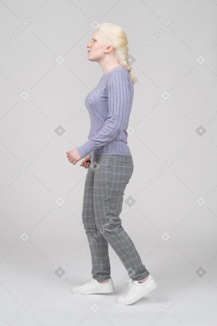 Woman walking left