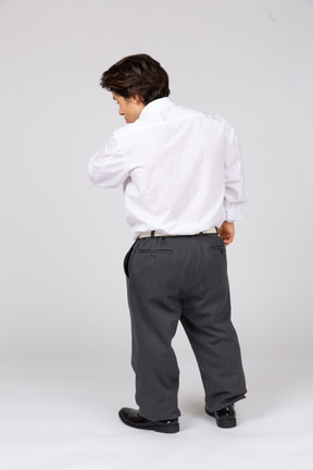 Back view of young man in white shirt