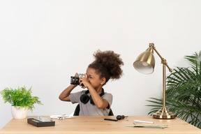 Cute girl taking a photo shot