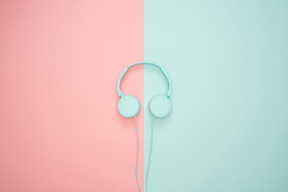 Blue headphones over contrast background