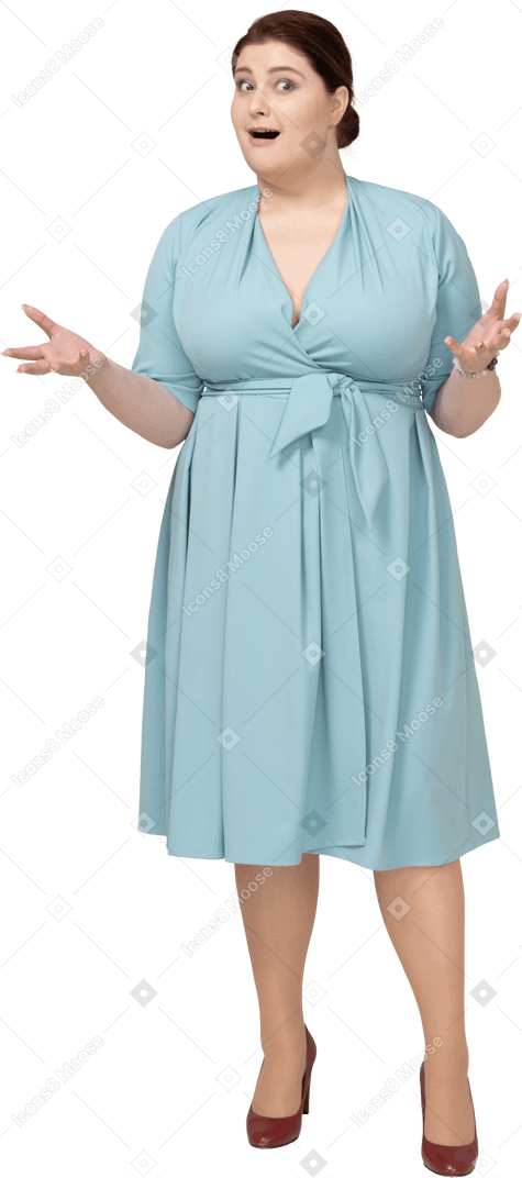 Front view of a happy woman in blue dress gesturing