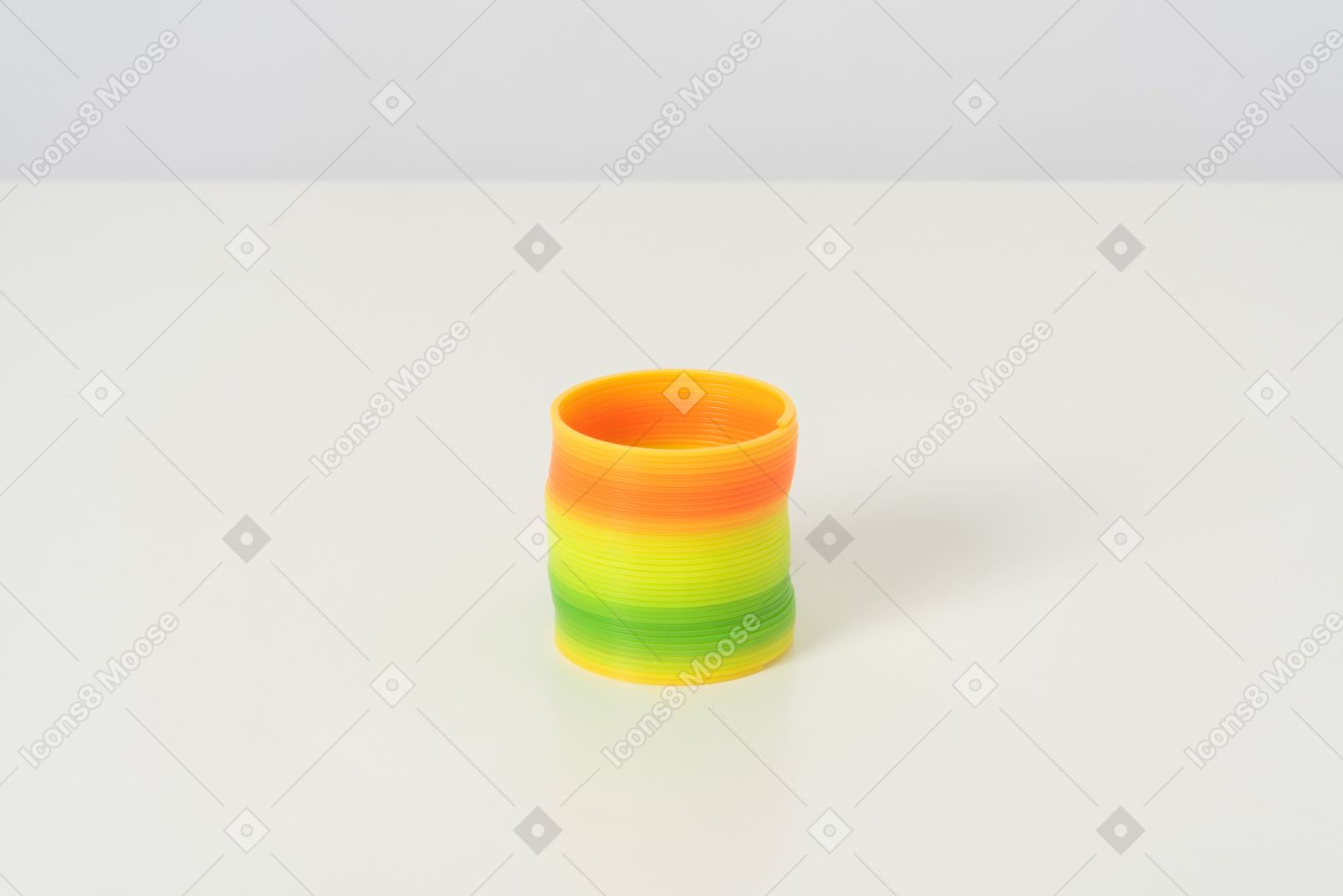 A colorful slinky toy in its default state