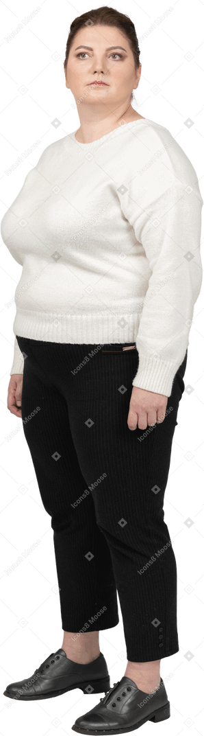 Plump woman in casual clothes standing