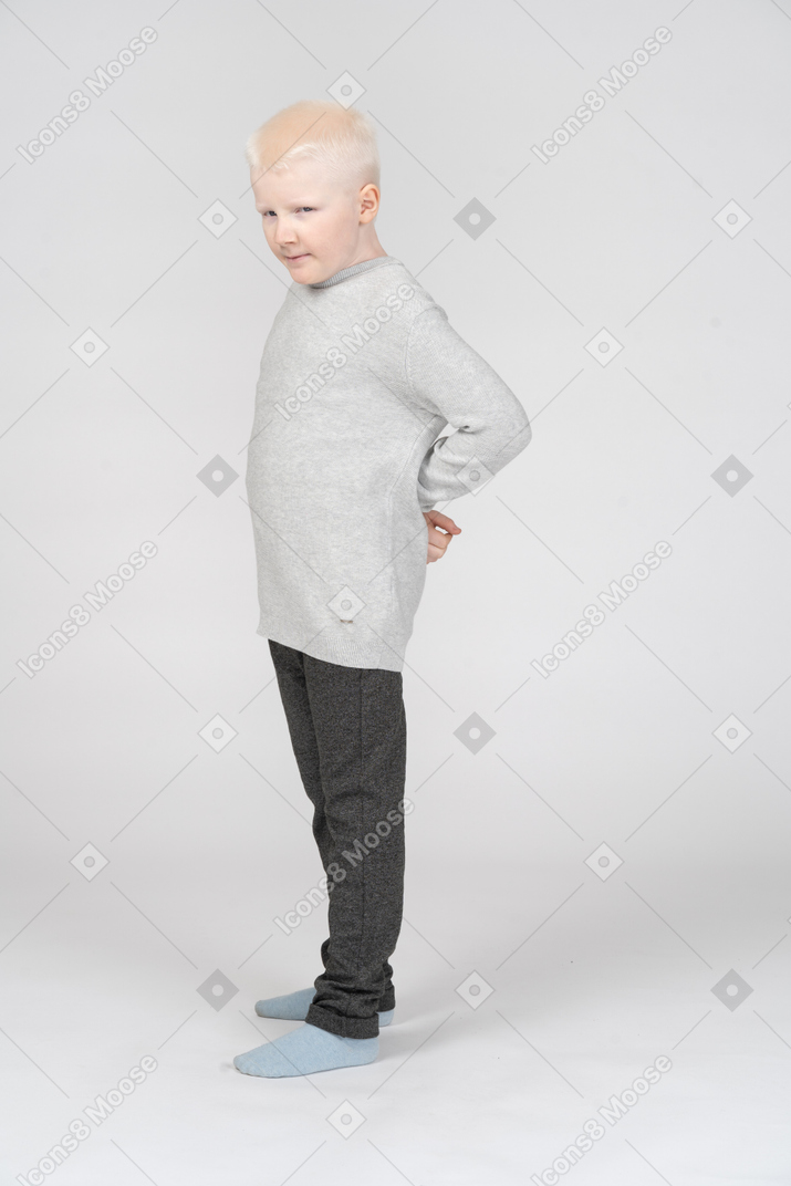 Full-length of an angry little blond boy in casual clothes