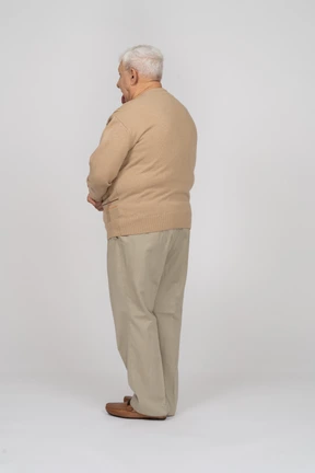 Rear view of an old man in casual clothes