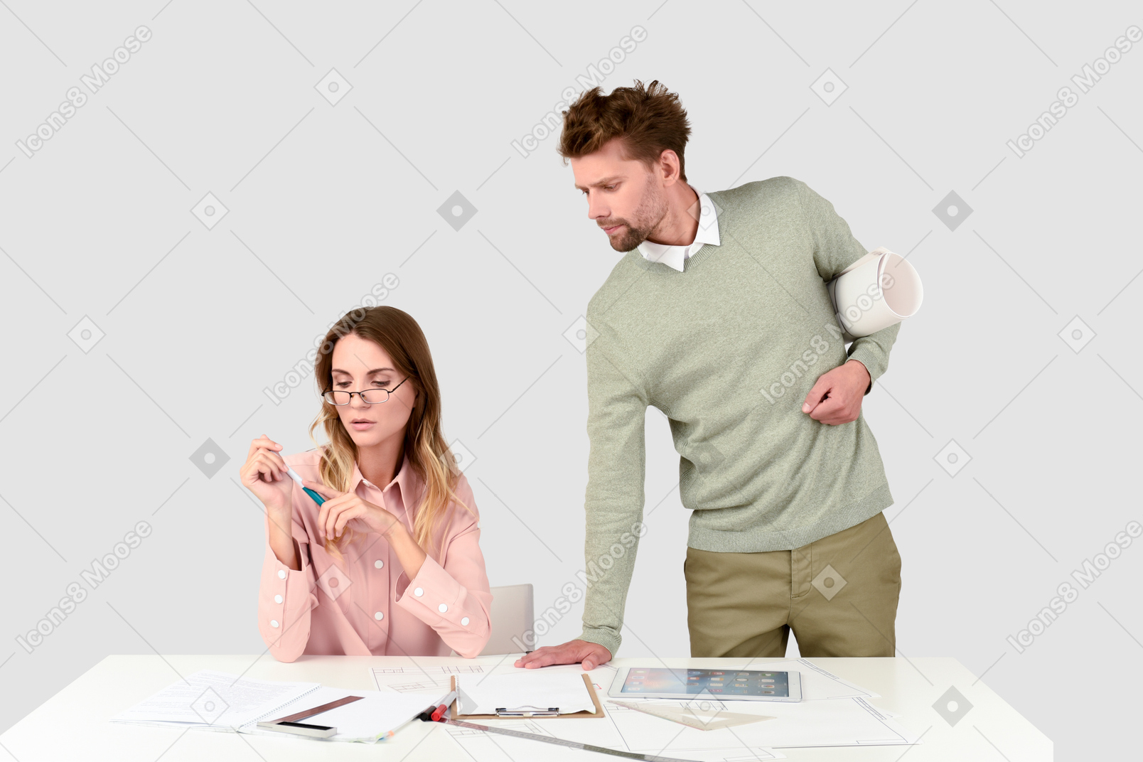 A man and a woman looking at papers on a table