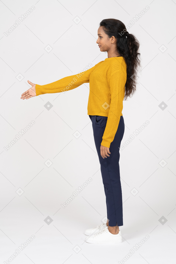 Side view of a girl in casual clothes giving a hand for shake